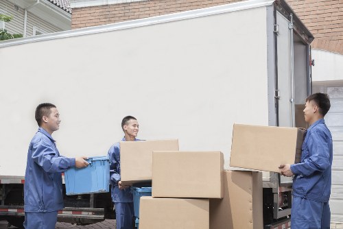Driver helping load items for a Holloway move