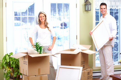 Packed office boxes and furniture ready for transport in North London